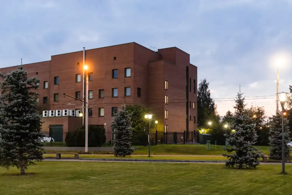 Green Lawn And Building Illuminated By Lantern 2024 10 17 18 29 36 Utc